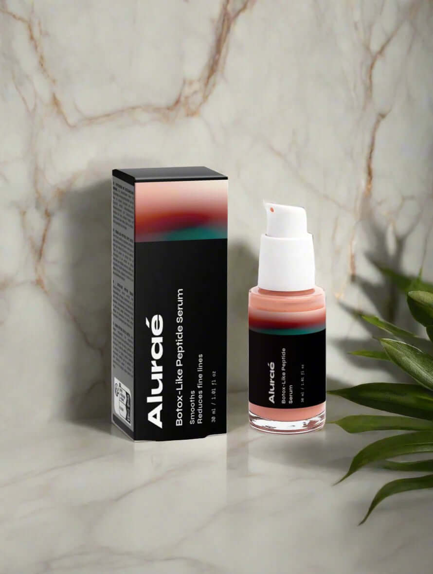 Aluráe Boost-Like Peptide Serum in elegant packaging on marble surface, perfect for skin care and beauty gifts.